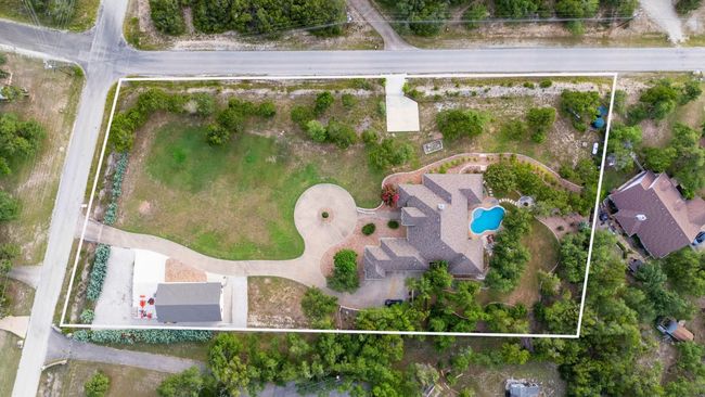 View of property location with property boundaries highlighted and a pool area | Image 39