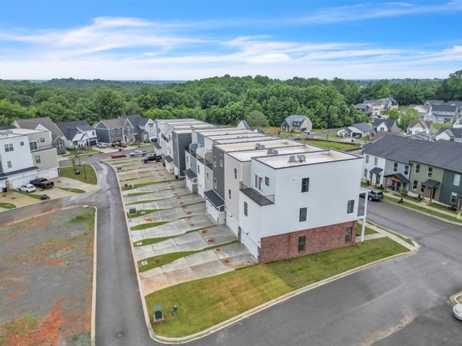 A great shot of the long private driveways & 2 car garages to these 7 unique townhomes. | Image 37