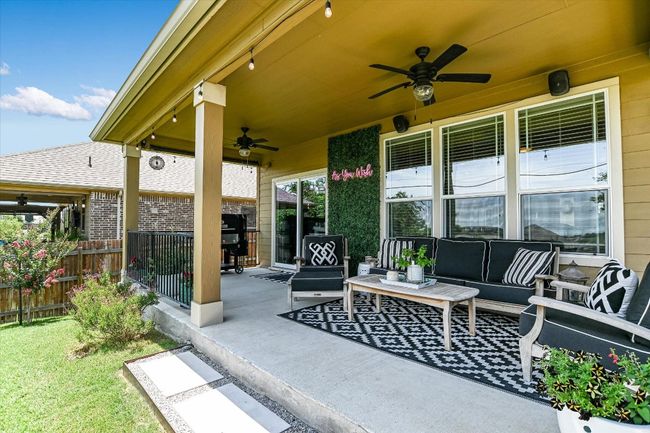 View of patio / terrace featuring a ceiling fan and outdoor lounge area | Image 26