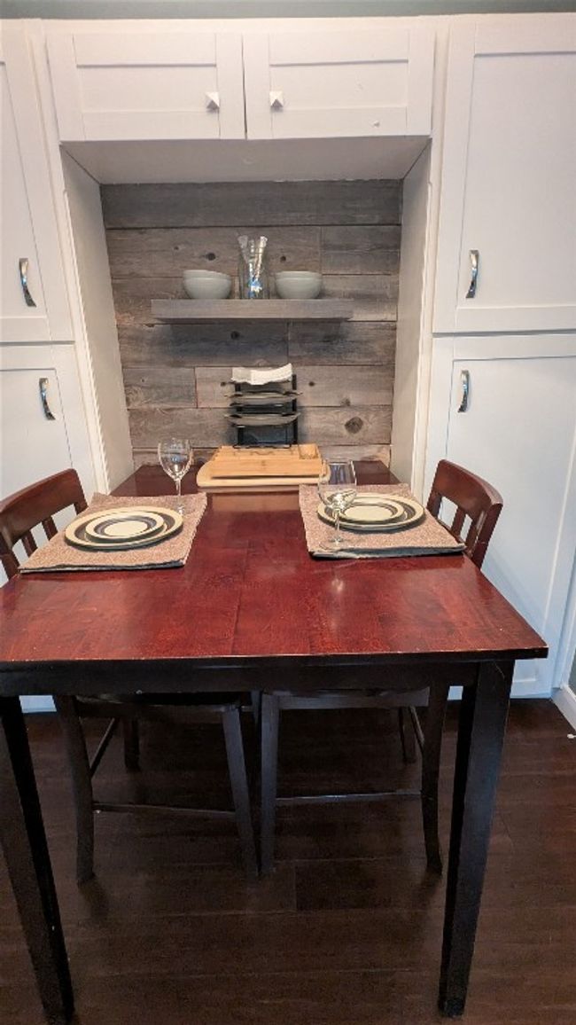 Dining area with wood finished floors | Image 16