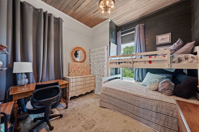 Bedroom featuring ornamental molding, wooden ceiling, and carpet floors | Image 19
