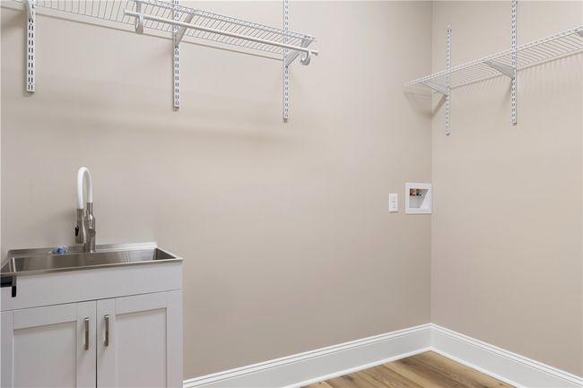 Laundry with sink. | Image 43