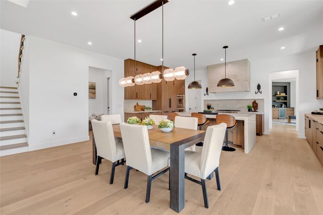 Dining room featuring stairway, light wood-style flooring, and recessed lighting | Image 6