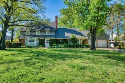 View of front of house with a garage and a front yard | Image 1