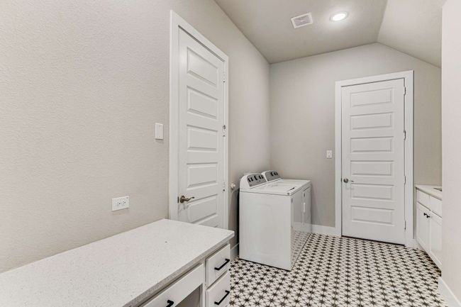 Generous laundry room with a sink and extra storage space! | Image 32