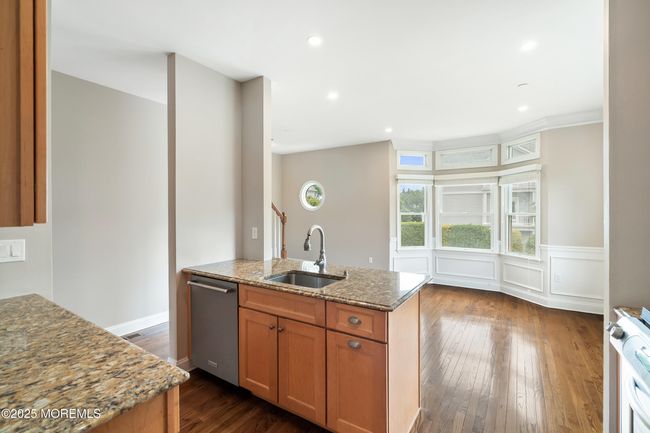 Kitchen area looking in to dining room facing the east-natural lighting | Image 14