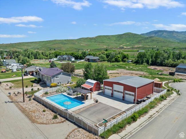 Drone / aerial view of a mountain backdrop and a pool | Image 40