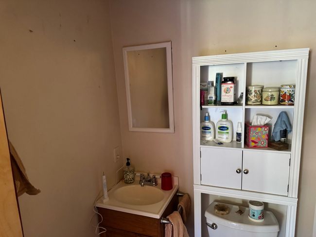 Half bathroom featuring vanity and toilet | Image 10