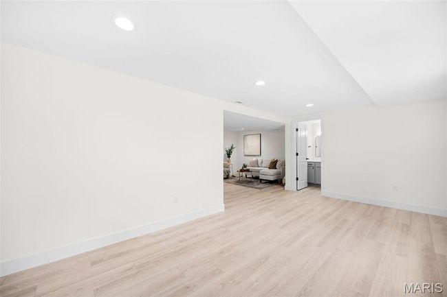 Unfurnished living room featuring light wood-style floors and recessed lighting | Image 37