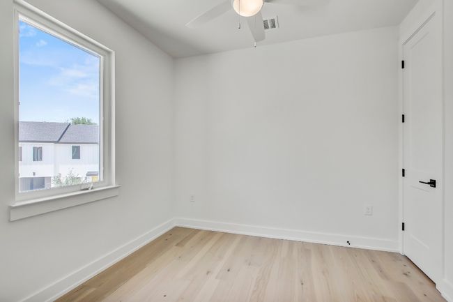 Spare room featuring light wood-style floors, ceiling fan, and baseboards | Image 26