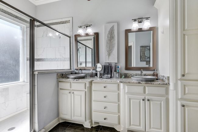 Full bath with a stall shower, double vanity, and crown molding | Image 20