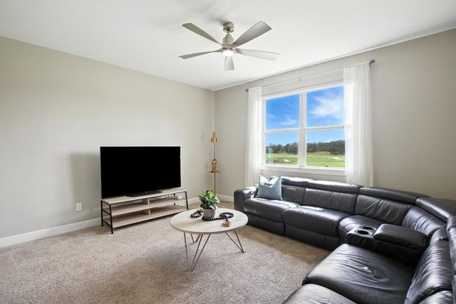 Living room featuring ceiling fan and carpet flooring | Image 14
