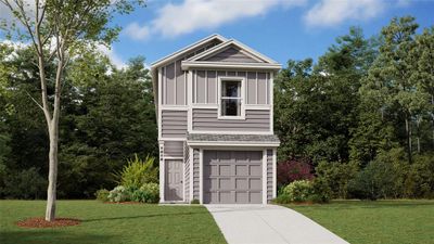 View of front of house featuring a garage and a front yard | Image 1