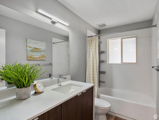 Bathroom with vanity and shower / tub combo with curtain | Image 25