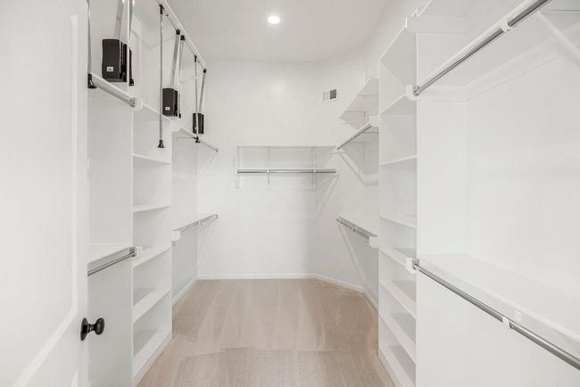 Primary walk-in closet. Pictures are NOT of this home. Pictures are of a model home and may contain upgrades not included in the price of this home. | Image 34