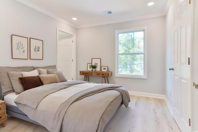 Bedroom with ornamental molding and light wood-type flooring | Image 15