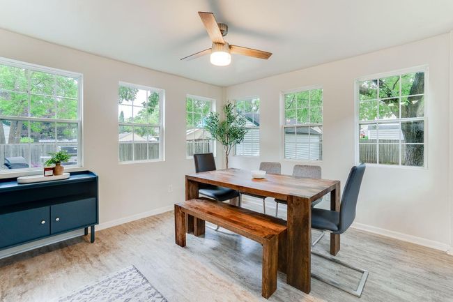 Sun-filled dining room full of beautiful pained windows | Image 4