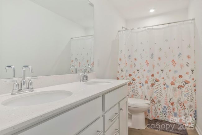 Secondary bathroom with dual vanity upstairs. | Image 15