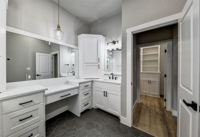 Bathroom featuring tile patterned flooring and vanity | Image 9