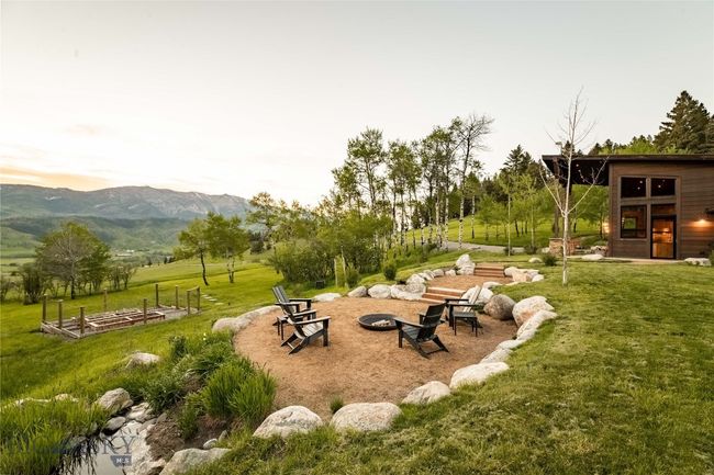 Underground sprinklers keep the grounds lush and the fenced gardens watered. | Image 5