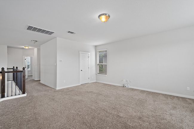 Carpeted spare room featuring baseboards | Image 27
