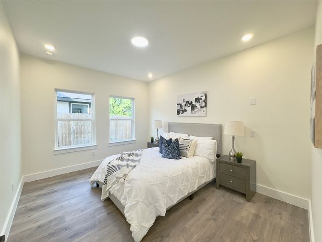 Bedroom with recessed lighting, wood finished floors, and baseboards | Image 14