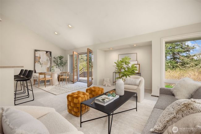 Here is the great room looking towards the breakfast nook with french doors leading towards another spacious deck. | Image 16