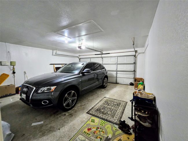 Garage featuring a garage door opener | Image 29