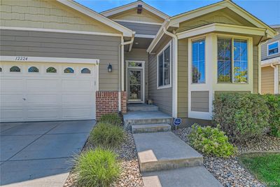 12224 Hannibal Street, House other with 4 bedrooms, 2 bathrooms and 2 parking in Commerce City CO | Image 2