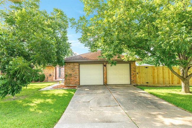 Two car detached garage at the back of the home. | Image 35