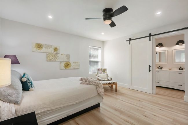 Modern Barn door seals off access in Primary Bedroom | Image 9
