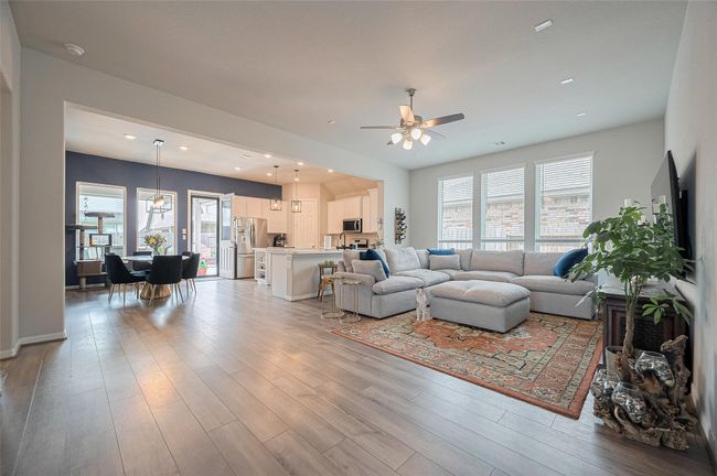 Open plan living with luxury vinyl tile throughout main living areas. | Image 16