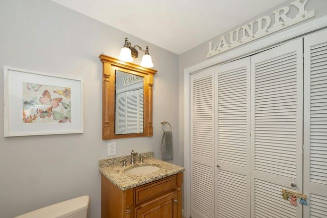 Lower level powder room with laundry | Image 23