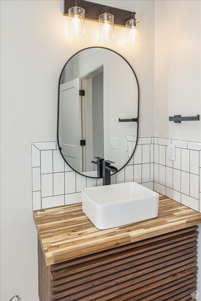 Bathroom featuring tasteful backsplash and vanity | Image 41