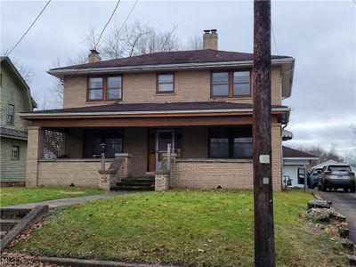 View of front of property featuring a front yard and a porch | Image 2