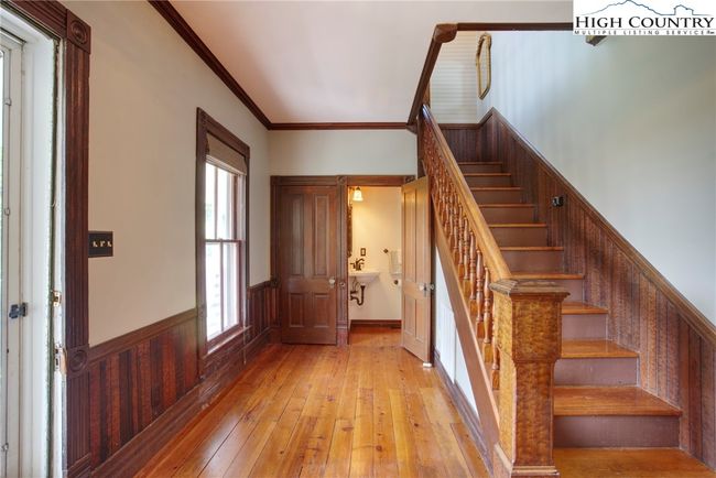 Adorable 1/2 bath beside the coat closet at entry foyer. | Image 10