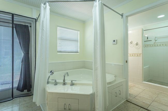 4-5 - 47 E Pine Ave, Home with 3 bedrooms, 2 bathrooms and 2 parking in Lanark Village FL | Image 11