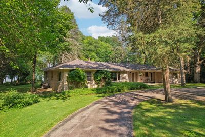 Welcome to 1330 N Dousman Road located on the west shoreline of Middle Genesee Lake. | Image 1