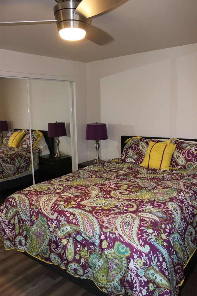 Bedroom featuring wood finished floors, a closet, and ceiling fan | Image 19