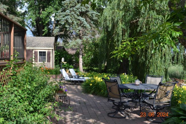 Well maintained landscaping surrounding the stunning patio. | Image 38
