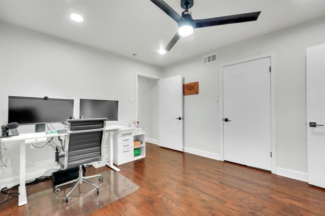 Office area featuring a ceiling fan, wood finished floors, and recessed lighting | Image 33