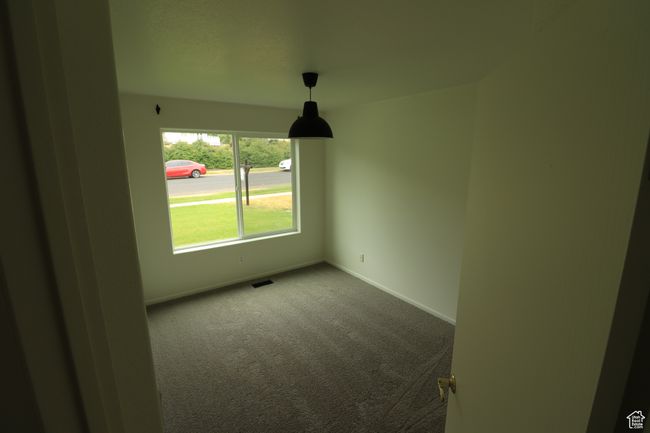 Carpeted empty room featuring baseboards | Image 12