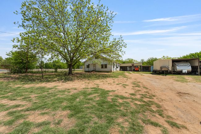 View of yard with driveway and a detached carport | Image 31