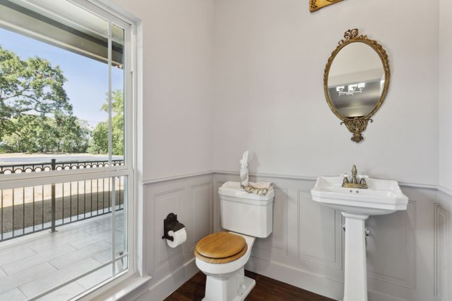 Bathroom featuring toilet and hardwood / wood-style floors | Image 16