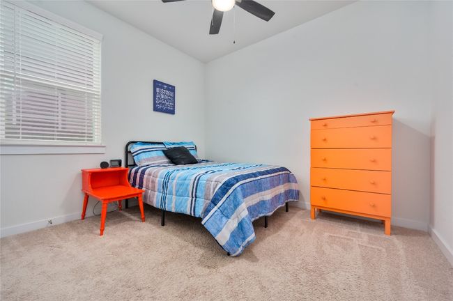 Carpeted bedroom featuring baseboards and a ceiling fan | Image 14