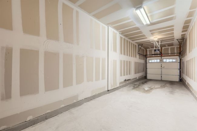 Garage with a garage door opener | Image 24
