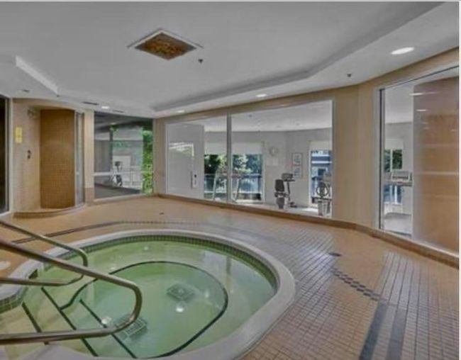View of pool featuring an indoor hot tub | Image 13