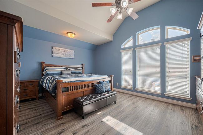 The spacious primary suite offers a peaceful retreat with ample room to relax and unwind. | Image 23
