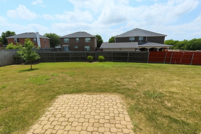 Fenced backyard featuring a patio | Image 27