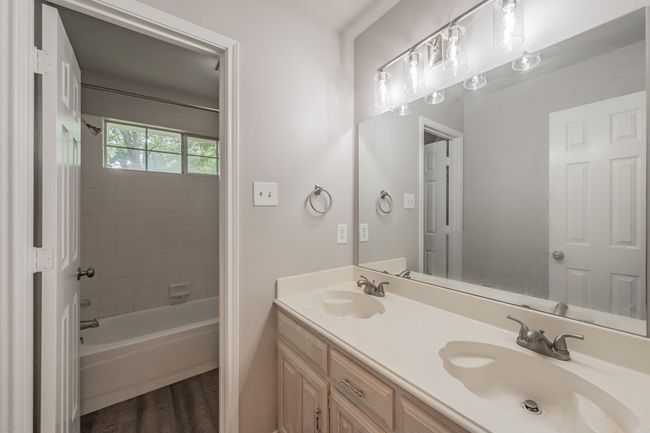 Guest bathroom on 2nd floor with double sinks & updated lighting and faucets. | Image 29